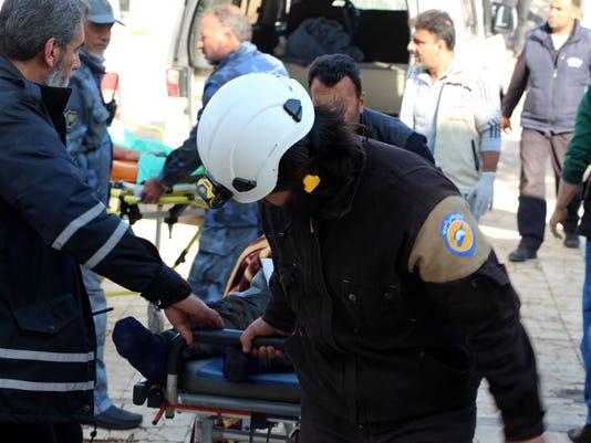 A paramedic with an injured man in stretcher